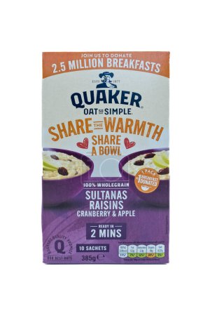Photo for Irvine, Scotland, UK-March 12, 2023: A box of Quaker branded Oat so simple porridge oats in a recyclable cardboard box and paper sachets displaying Kcal information and graphics relevant to the product. - Royalty Free Image