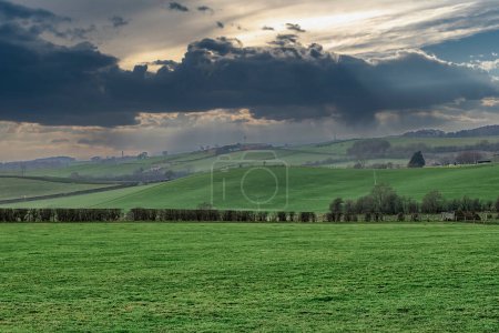 Photo for Ayrshire Fields as the heavy rain moves accross the image making it hazy with a dramatic Scottish sky in Scotlands winter. - Royalty Free Image