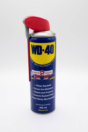 Photo for Irvine, Scotland, UK - February  02, 2023: WD-40 branded multi-use spray in a 450ml compressed tin can with plastic trigger and straw. - Royalty Free Image