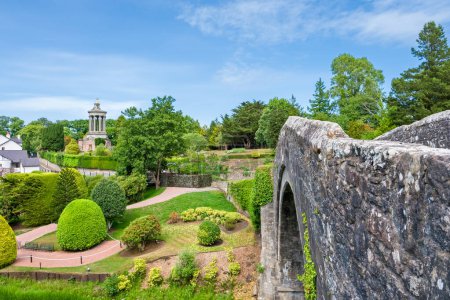 Photo for Burns Memorial and free gardens in Alloway near Ayr Scotland about to celebrate its 200th anniversary Image taken from the Auld Brig looking over to the gardens. - Royalty Free Image