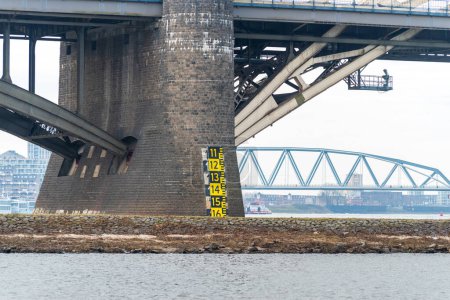 Pillar of the Waal bridge at Nijmegen, Netherlands with water level indicator
