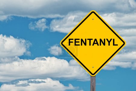 Photo for Fentanyl Caution Sign - Blue Sky Background - Royalty Free Image