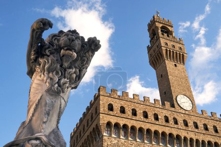 Photo for 06 Dec, 2021 - Florence, Italy. Sculpture Pieta depicting a rampant lion with a Roman sculpture head in its mouth by contemporary Italian artist Francesco Vezzoli installed on Piazza della Signoria - Royalty Free Image