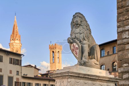 Photo for Marzocco lion protecting the giglio symbol of Florence - Royalty Free Image