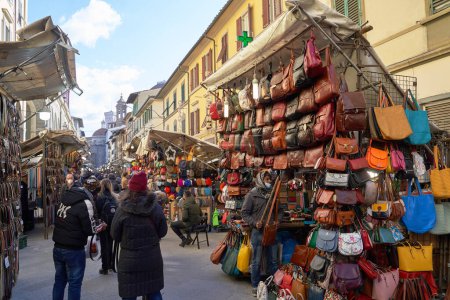 Photo for 06 Dec, 2021 - Florence, Italy. San Lorenzo Street Market with many lether goods such as belts, bags, and wallets on display - Royalty Free Image
