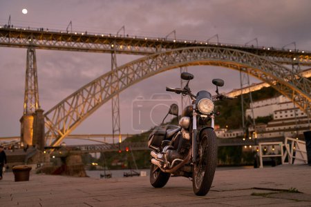 Photo for Old bike on background of the Dom Luis I Bridge in Porto, Portugal - Royalty Free Image