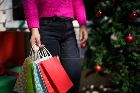 Photo for Happy asian girl hold shopping bags Xmas present. cheerful woman with Christmas New Year Winter sale. - Royalty Free Image