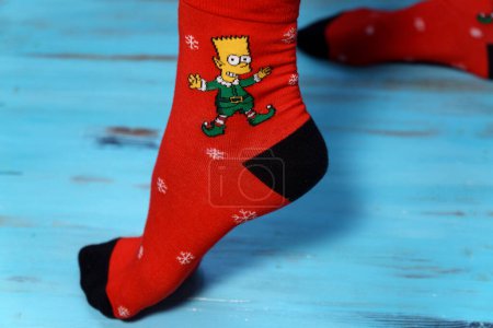 Photo for Tyumen, Russia-January 23, 2023: Bart Simpson from The Simpsons animated series logo on clothes, Christmas socks - Royalty Free Image