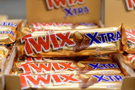 Photo for Tyumen, Russia-January 26, 2023: Twix is a caramel shortbread chocolate bar made by Mars, Inc. With clipping path - Royalty Free Image