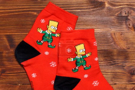 Photo for Tyumen, Russia-January 23, 2023: Bart Simpson from The Simpsons animated series logo on clothes, Christmas socks - Royalty Free Image