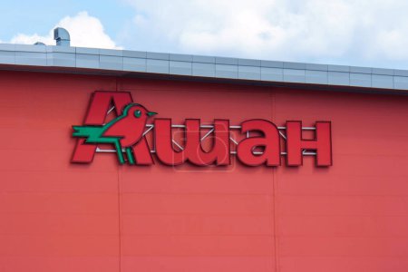 Photo for Tyumen, Russia-August 09, 2023: Auchan logo on a shopping centre wall - Royalty Free Image
