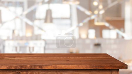 Foto de Empty table, tabletop and blurred interior of cafe or restaurant - Imagen libre de derechos