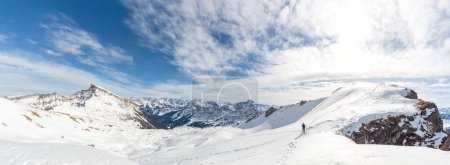 Photo for Man hiking with snowshoes in beautiful winter mountain landscape. Alps, Germany, Bavaria, Allgaeu. - Royalty Free Image