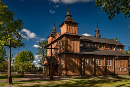 Photo for NAREW, POLAND - SEPTEMBER 16, 2022: Old wooden Roman catholic church of St Stanislaus the Martyr in Narew village, Podlasie region. - Royalty Free Image