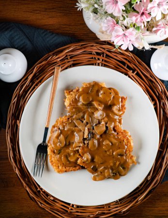 Sauerkraut pancakes /fuczki/ with mushroom sauce - a traditional Lemko dish.