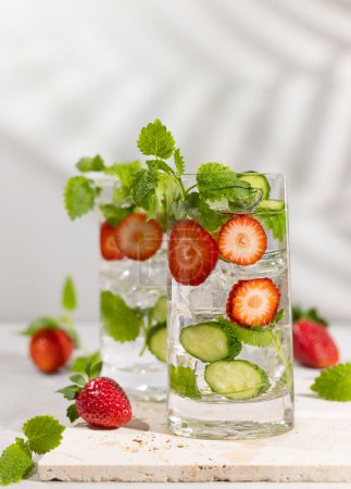 Photo for Summer detox drink. Strawberry, mint and cucumber refreshing water.Infused detox water with berry, vegetable and herb. Ice cold summer lemonade. - Royalty Free Image