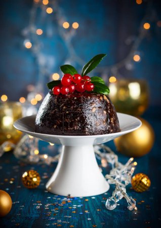 Christmas pudding decorated with holly