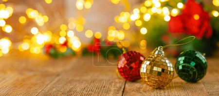 Photo for Christmas or New Year still life with baubles below Christmas Tree on a wooden table. Festive concept. - Royalty Free Image