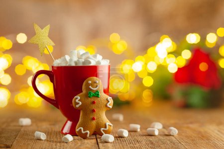 Photo for Christmas homemade gingerbread cookie and cup of hot chocolate with marshmallow on wooden table. Christmas food and drink concept - Royalty Free Image