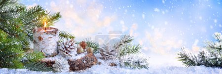Photo for Christmas or New Year Holiday composition with burning candle, pine cones and fir tree. Winter holiday background. Banner - Royalty Free Image