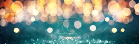 Photo for Abstract Festive deep blue teal Background with colorful glitter lights. Defocused backdrop and shine bokeh. Banner - Royalty Free Image