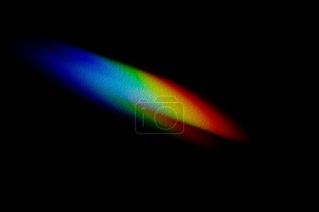 Photo for Rainbow reflective colorful sunlight on textured surface of wall. Dispersion and refraction of light. - Royalty Free Image