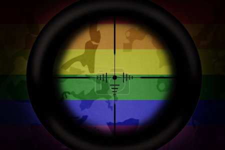 Foto de Alcance francotirador dirigido a arco iris bandera gay en el fondo de textura caqui. concepto militar. ilustración 3d - Imagen libre de derechos