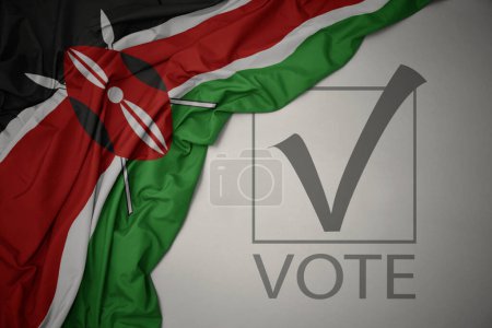 Foto de Ondeando colorida bandera nacional de Kenya sobre un fondo gris con voto de texto. concepto de elección. Ilustración 3D - Imagen libre de derechos