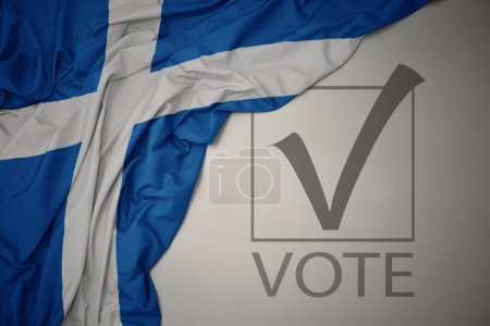 Foto de Ondeando colorida bandera nacional de Escocia sobre un fondo gris con voto de texto. concepto de elección. Ilustración 3D - Imagen libre de derechos