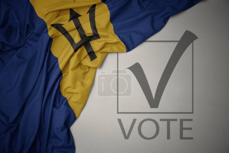 Foto de Ondeando colorida bandera nacional de barbados sobre un fondo gris con voto de texto. concepto de elección. Ilustración 3D - Imagen libre de derechos