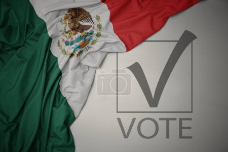 Foto de Ondeando colorida bandera nacional de México sobre un fondo gris con voto de texto. concepto de elección. Ilustración 3D - Imagen libre de derechos