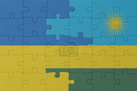 Téléchargez les photos : Puzzle avec le drapeau national de l'ukraine et rwanda. macro.concept. Illustration 3d - en image libre de droit