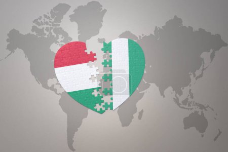 Photo for Puzzle heart with the national flag of nigeria and hungary on a world map background.Concept. 3D illustration - Royalty Free Image