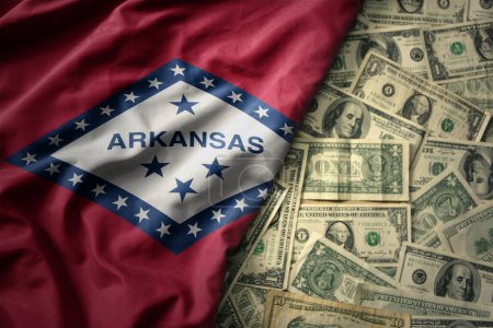Photo for Big colorful waving national flag of arkansas state on a american dollar money background. finance concept - Royalty Free Image