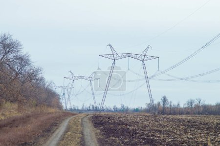 Photo for Large power line towers against the sky - Royalty Free Image