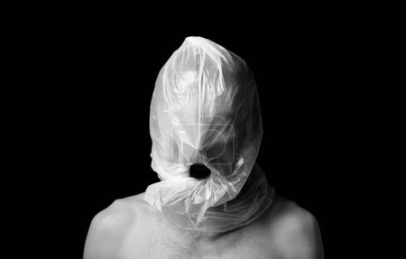 Photo for Portrait strangulation, plastic bag on head - Royalty Free Image