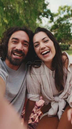 Photo for Couple in love making video call with mobile phone - Royalty Free Image