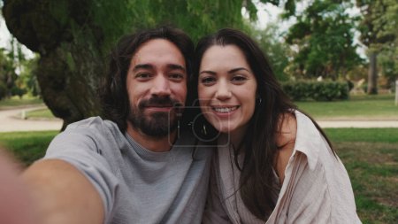 Photo for Couple in love making video call with mobile phone - Royalty Free Image