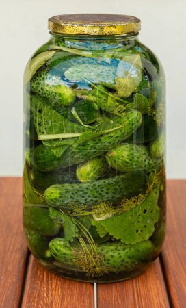 Photo for Big jar of tasty and healthy pickled cucumbers. Closeup shot. Traditional polish appetizer. - Royalty Free Image