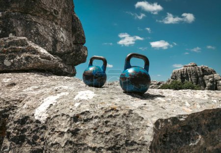 Photo for Two Blue 12kg/26lbs Kettlebells - Royalty Free Image