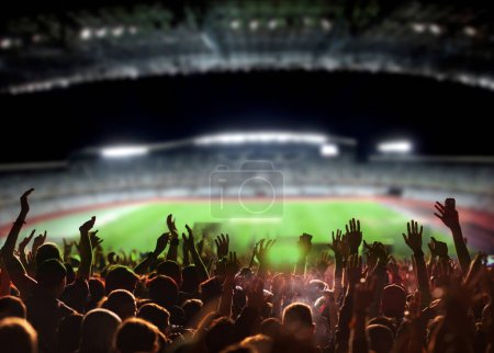 Téléchargez les photos : Fans de football ou de soccer lors d'un match dans un stade - en image libre de droit