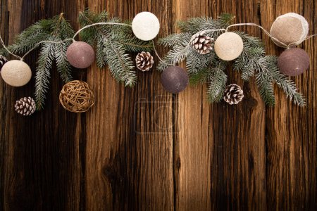 Photo for Christmas decorations and lights on wooden table - Royalty Free Image