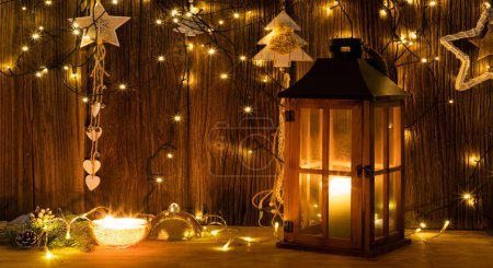Photo for Christmas lights and decorations on wooden background - Royalty Free Image