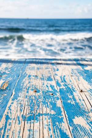 Photo for Empty wooden table and sea in background - Royalty Free Image