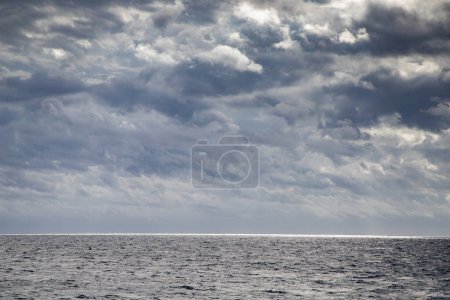 Photo for Seascape with dark clouds and light - Royalty Free Image