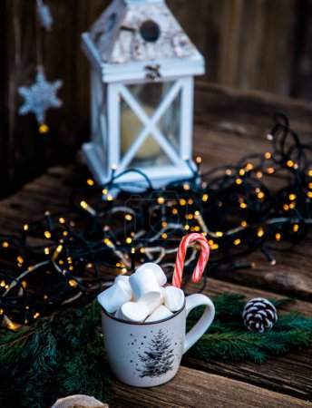 Photo for Hot Christmas drink with marshmallow on wooden table - Royalty Free Image