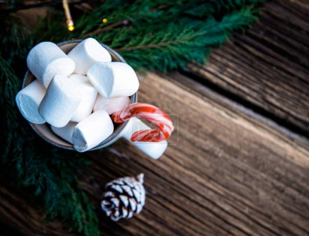 Photo for Hot Christmas drink with marshmallow on wooden table - Royalty Free Image