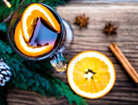 Photo for Mulled wine Christmas drink  on wooden table - Royalty Free Image