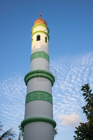 Photo for Islamic mosque tower on blue sky - Royalty Free Image