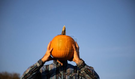 Photo for Man holding Hallowing pumpkin - Royalty Free Image